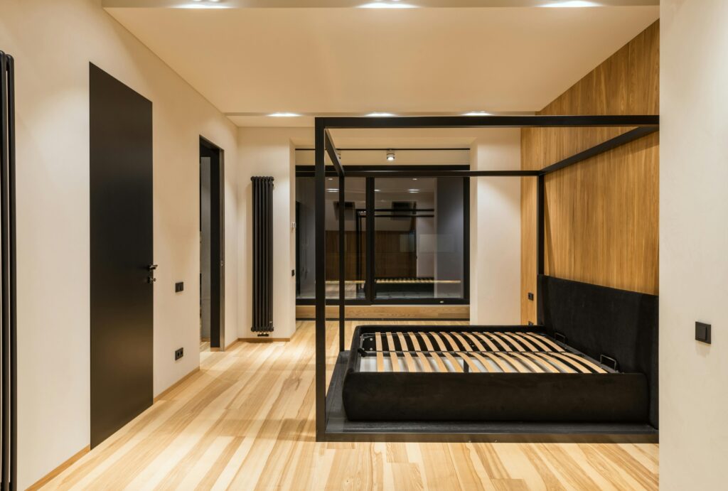 Sleek contemporary bedroom with wooden floor and stylish design. Ideal interior inspiration.